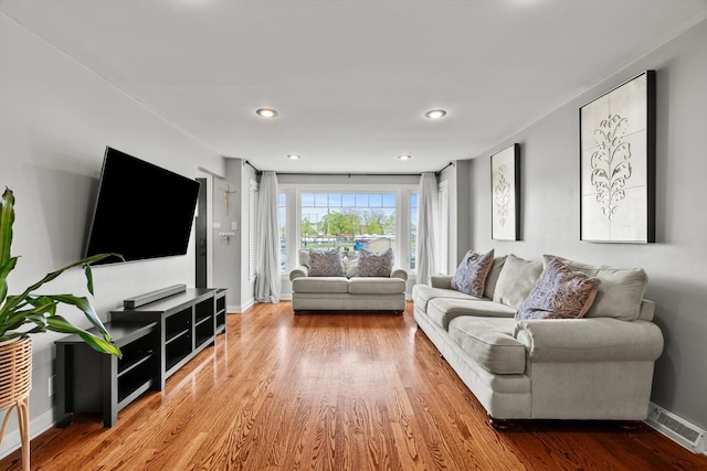 11026 S S Ave H, Chicago, IL 60617 - living room featuring wood finished floors, baseboards, and recessed lighting