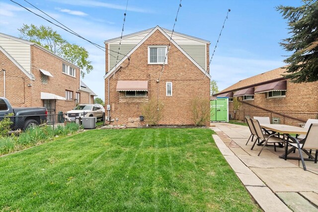 11026 S S Ave H, Chicago, IL 60617 - back of house with brick siding and a patio