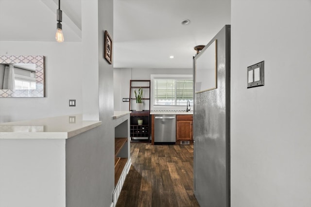 11026 S S Ave H, Chicago, IL 60617 - kitchen with dishwasher, dark wood-style flooring, brown cabinetry, a sink, and light countertops