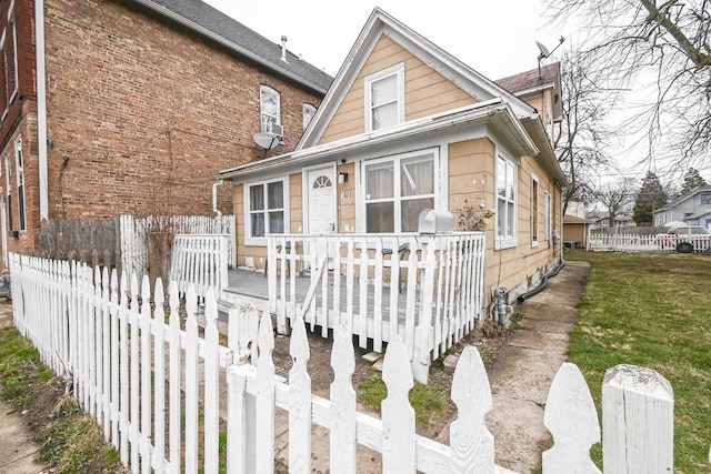 1423 Victoria Ave, North Chicago, IL 60064 - view of front of property featuring a deck and fence