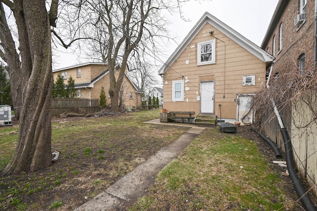 1423 Victoria Ave, North Chicago, IL 60064 - rear view of property featuring entry steps, fence, and cooling unit