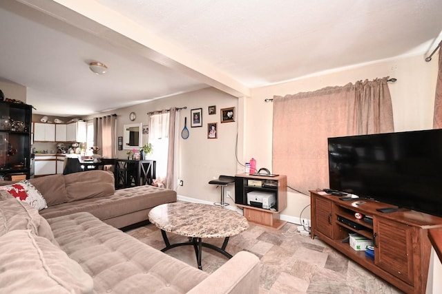 1423 Victoria Ave, North Chicago, IL 60064 - living room with baseboards and stone finish floors