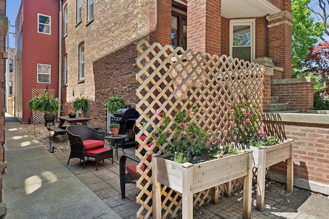 view of patio featuring a grill
