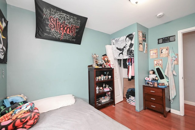 1911 Elizabeth Ave, North Chicago, IL 60064 - bedroom with wood finished floors and baseboards