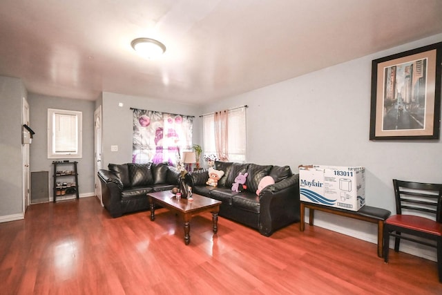 1911 Elizabeth Ave, North Chicago, IL 60064 - living area with wood finished floors, baseboards, and healthy amount of natural light