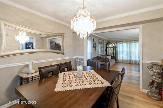 772 Red Oak Dr, Bartlett, IL 60103 - dining space featuring a chandelier, wood finished floors, and ornamental molding
