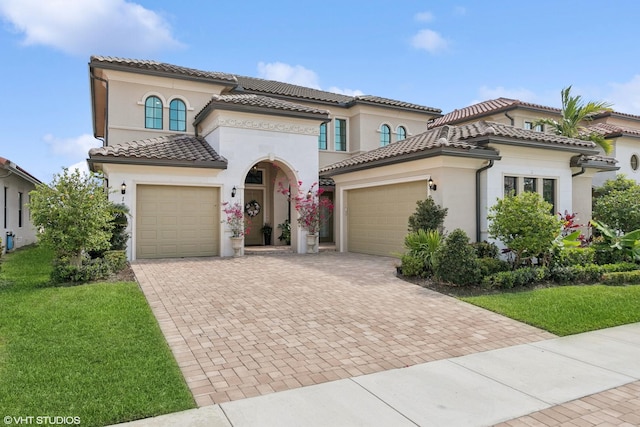 12060 Lake Trail Ln, Parkland, FL 33076 - mediterranean / spanish home with an attached garage, decorative driveway, stucco siding, and a front yard