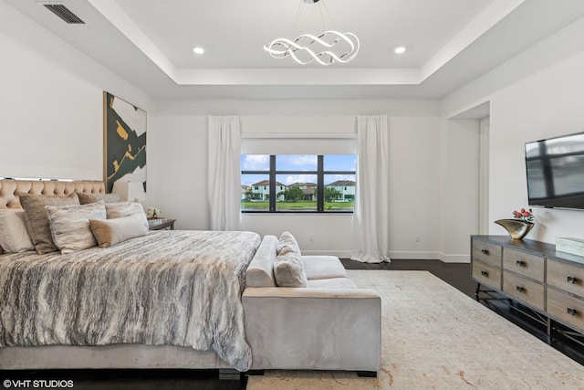 12060 Lake Trail Ln, Parkland, FL 33076 - bedroom with a tray ceiling, a chandelier, recessed lighting, dark wood finished floors, and baseboards