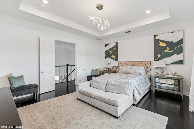 12060 Lake Trail Ln, Parkland, FL 33076 - bedroom with dark wood-style flooring, a tray ceiling, recessed lighting, and a chandelier