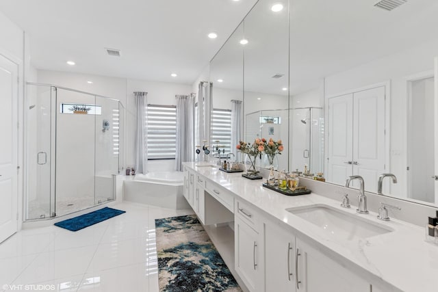 12060 Lake Trail Ln, Parkland, FL 33076 - full bath with a garden tub, a stall shower, tile patterned flooring, double vanity, and recessed lighting