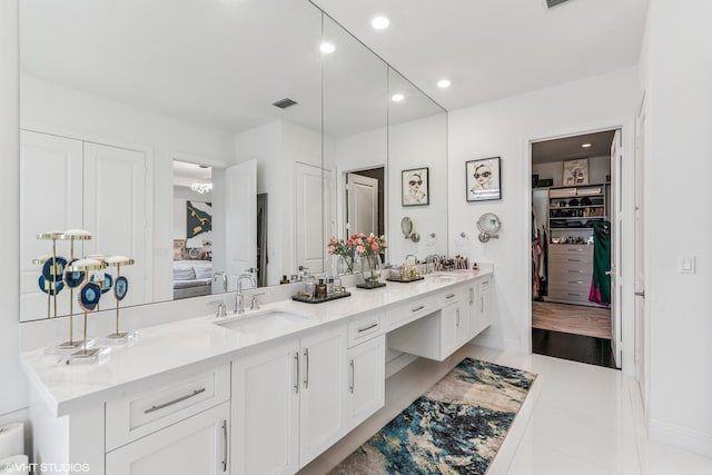 12060 Lake Trail Ln, Parkland, FL 33076 - full bath with double vanity, connected bathroom, recessed lighting, baseboards, and a spacious closet