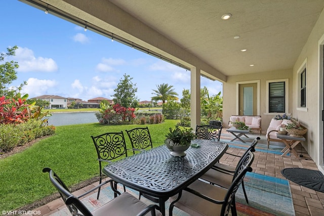 12060 Lake Trail Ln, Parkland, FL 33076 - view of patio / terrace with a water view, an outdoor hangout area, and outdoor dining space