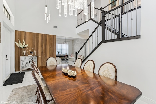 12060 Lake Trail Ln, Parkland, FL 33076 - dining area featuring a high ceiling, a chandelier, stairs, and marble finish floors