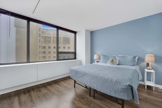 bedroom with wood finished floors