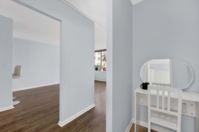 office space with wood finished floors and baseboards