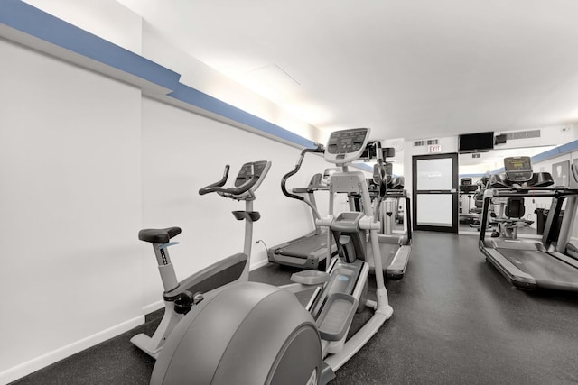 gym featuring baseboards