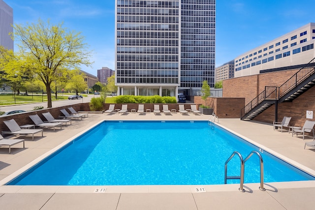 community pool with a patio area