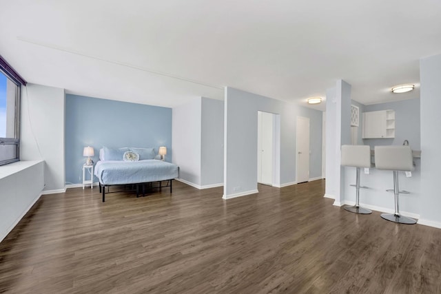 living area featuring wood finished floors and baseboards