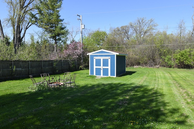 41066 N 3rd St, Antioch, IL 60002 - view of yard with a storage unit, a fire pit, and an outbuilding
