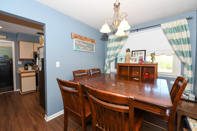 41066 N 3rd St, Antioch, IL 60002 - dining area featuring dark wood-type flooring, a chandelier, and baseboards