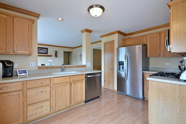2209 Beaumont Ct, Aurora, IL 60502 - kitchen with appliances with stainless steel finishes, a sink, crown molding, light countertops, and light wood-style flooring