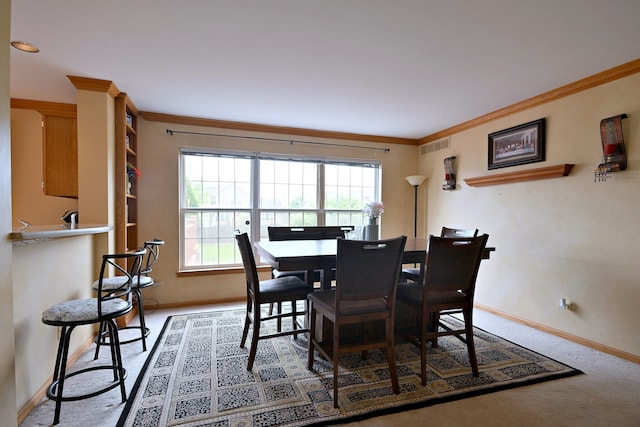 2209 Beaumont Ct, Aurora, IL 60502 - dining room featuring baseboards, ornamental molding, and carpet flooring