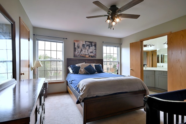 2209 Beaumont Ct, Aurora, IL 60502 - bedroom featuring ensuite bathroom, baseboards, a sink, and ceiling fan