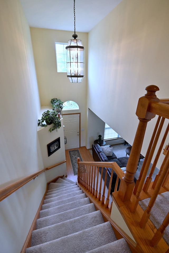 2209 Beaumont Ct, Aurora, IL 60502 - stairway with wood finished floors and a towering ceiling