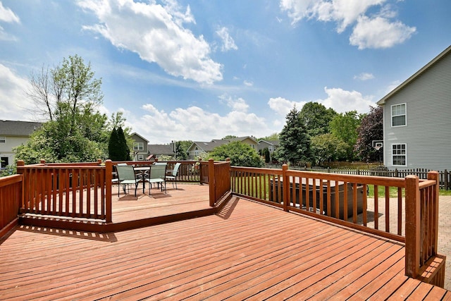 2209 Beaumont Ct, Aurora, IL 60502 - wooden terrace featuring outdoor dining space, a fenced backyard, and a residential view