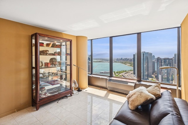505 N Lake Shore Dr Unit 4907, Chicago, IL 60611 - living area with a wall mounted AC, a city view, light tile patterned flooring, and a water view