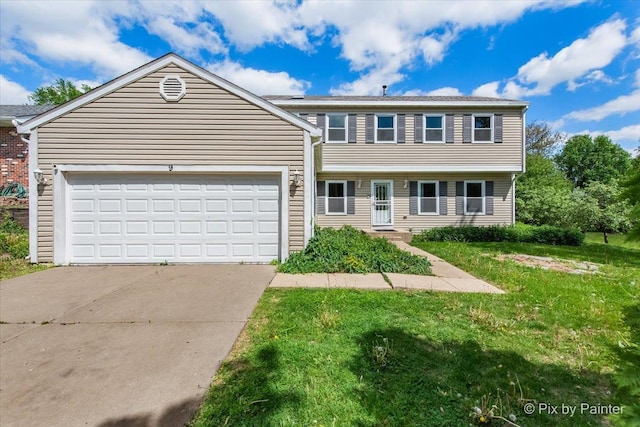 9 N Walnut Ct, Streamwood, IL 60107 - view of front of home with driveway, a front yard, and a garage