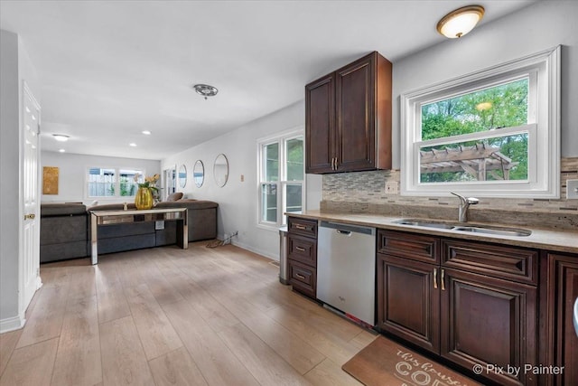 9 N Walnut Ct, Streamwood, IL 60107 - kitchen with stainless steel dishwasher, a sink, decorative backsplash, light wood-type flooring, and recessed lighting