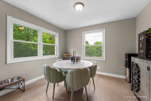 9 N Walnut Ct, Streamwood, IL 60107 - dining room featuring baseboards and light wood-type flooring