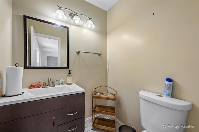 9 N Walnut Ct, Streamwood, IL 60107 - bathroom featuring toilet, vanity, and baseboards