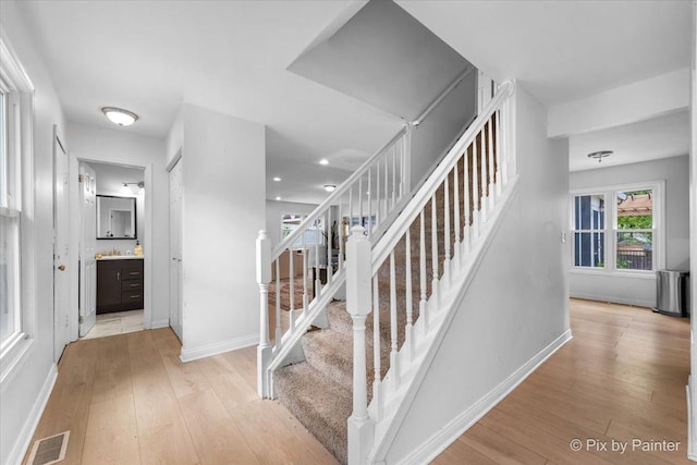 9 N Walnut Ct, Streamwood, IL 60107 - stairs featuring hardwood / wood-style floors, baseboards, and recessed lighting