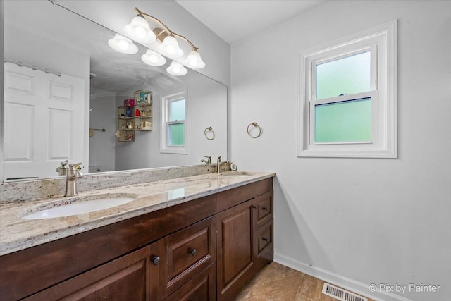 9 N Walnut Ct, Streamwood, IL 60107 - bathroom featuring double vanity, baseboards, and tile patterned floors