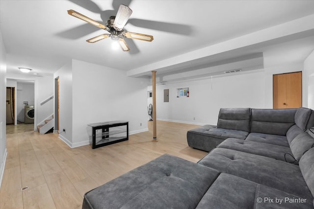 9 N Walnut Ct, Streamwood, IL 60107 - living room with washer / clothes dryer, ceiling fan, light wood-type flooring, stairway, and baseboards