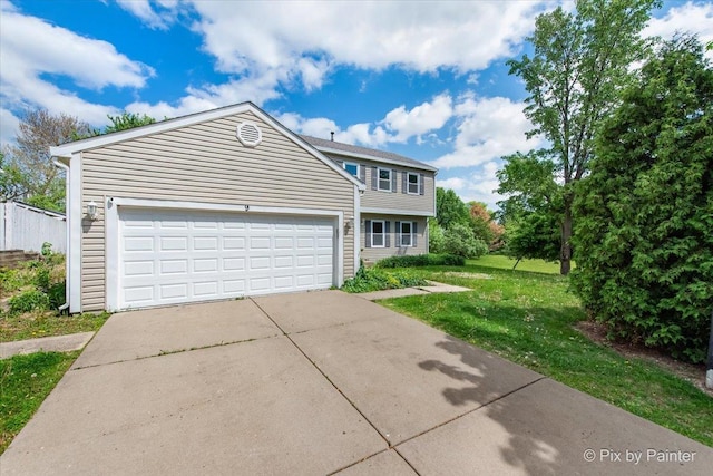 9 N Walnut Ct, Streamwood, IL 60107 - view of front of house featuring a front lawn, an attached garage, and driveway