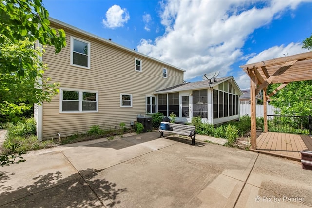 9 N Walnut Ct, Streamwood, IL 60107 - rear view of house featuring a sunroom, a pergola, a patio, central AC unit, and a deck