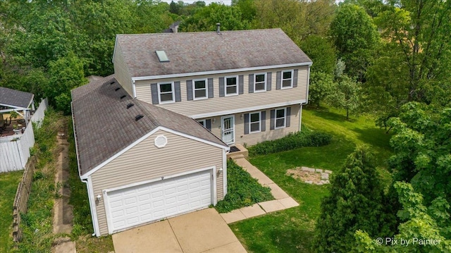 9 N Walnut Ct, Streamwood, IL 60107 - colonial inspired home with a front yard, roof with shingles, and a garage