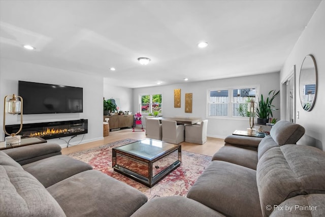 9 N Walnut Ct, Streamwood, IL 60107 - living room featuring wood finished floors, healthy amount of natural light, recessed lighting, baseboards, and a glass covered fireplace