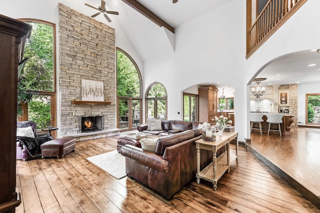 3113 Turnberry Rd, Saint Charles, IL 60174 - living area with high vaulted ceiling, ceiling fan, hardwood / wood-style floors, a fireplace, and arched walkways