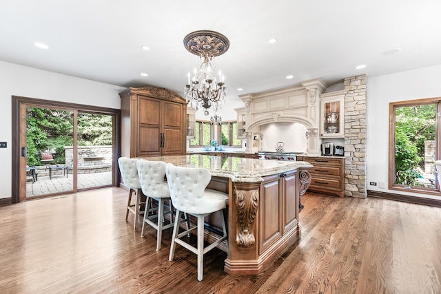 3113 Turnberry Rd, Saint Charles, IL 60174 - kitchen with a center island, light stone countertops, a chandelier, light wood finished floors, and recessed lighting
