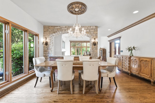 3113 Turnberry Rd, Saint Charles, IL 60174 - dining area with a chandelier, wood finished floors, healthy amount of natural light, and ornamental molding