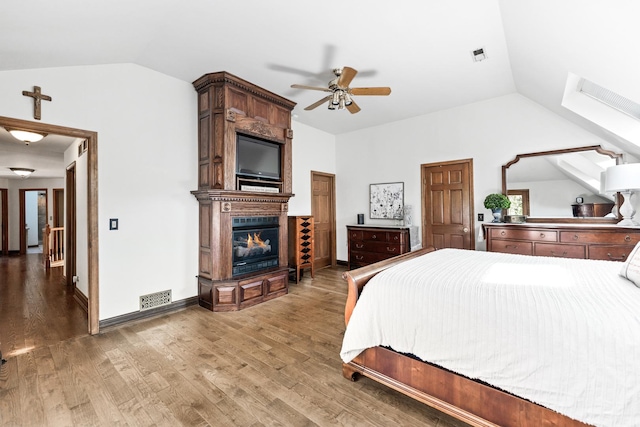 3113 Turnberry Rd, Saint Charles, IL 60174 - bedroom featuring vaulted ceiling, a fireplace, wood finished floors, a ceiling fan, and baseboards