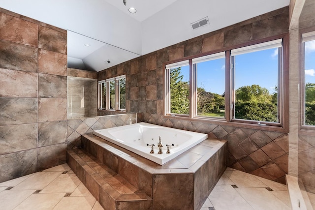 3113 Turnberry Rd, Saint Charles, IL 60174 - bathroom featuring tile walls, tile patterned flooring, vaulted ceiling, a whirlpool tub, and healthy amount of natural light