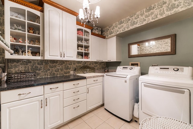 3113 Turnberry Rd, Saint Charles, IL 60174 - laundry room featuring cabinet space, washer and clothes dryer, light tile patterned floors, and a chandelier