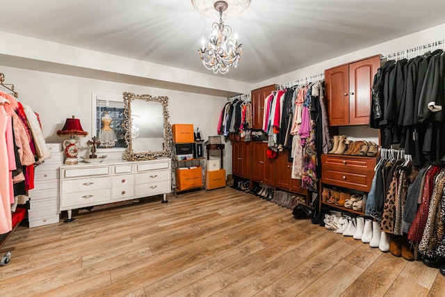 3113 Turnberry Rd, Saint Charles, IL 60174 - walk in closet with light wood-style floors and a chandelier