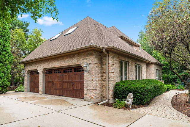 3113 Turnberry Rd, Saint Charles, IL 60174 - view of side of property with roof with shingles, an attached garage, and concrete driveway
