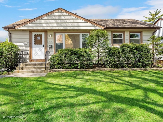 2384 Magnolia St, Des Plaines, IL 60018 - view of front facade featuring a front yard and a shingled roof